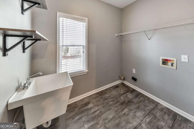 laundry room with hookup for a washing machine and sink