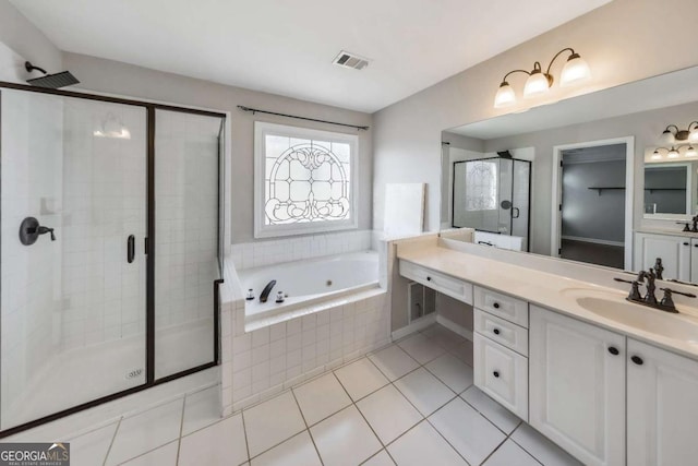 bathroom featuring vanity, tile patterned floors, and shower with separate bathtub