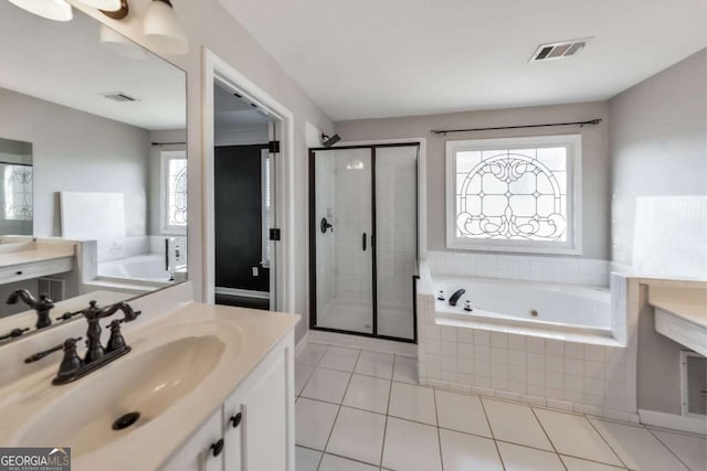 bathroom with vanity, separate shower and tub, and tile patterned flooring