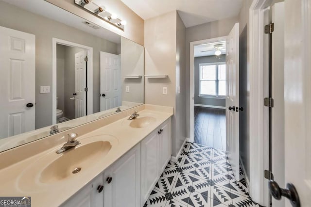 bathroom with vanity and toilet