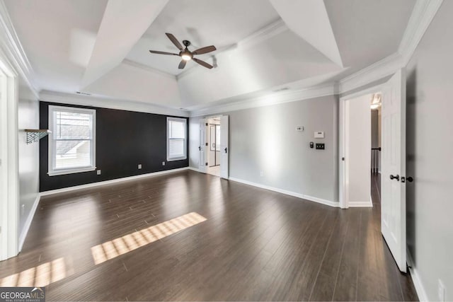 spare room with crown molding, dark wood-type flooring, and ceiling fan