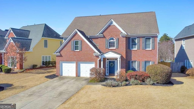 view of front of property with a garage and a front yard