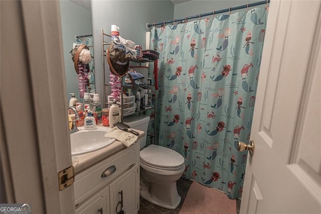 bathroom featuring tile patterned floors, vanity, toilet, and a shower with shower curtain