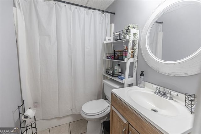 bathroom with a shower with shower curtain, vanity, toilet, and tile patterned flooring