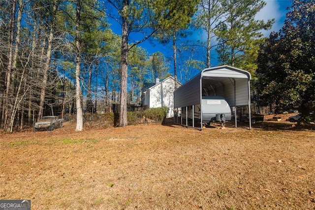 view of yard with a carport