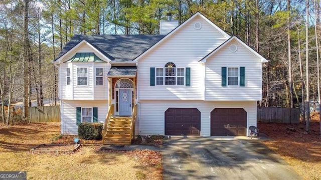 split foyer home featuring a garage