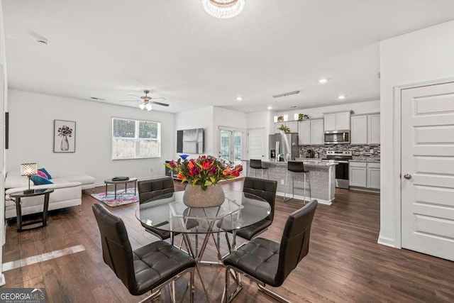 dining room featuring ceiling fan and dark hardwood / wood-style floors