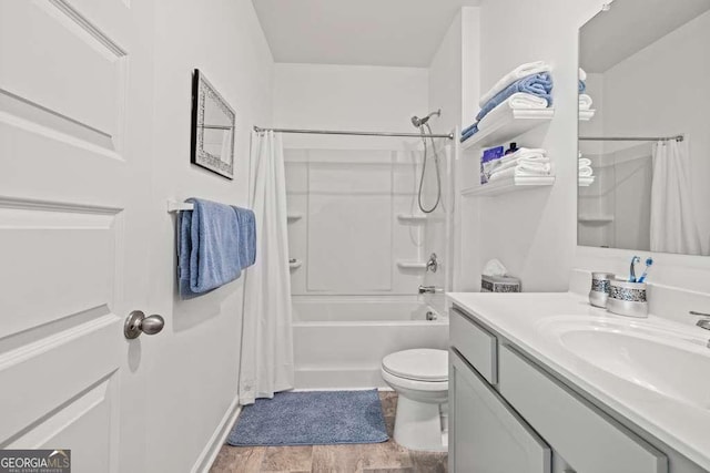 full bathroom with vanity, wood-type flooring, toilet, and shower / bath combo