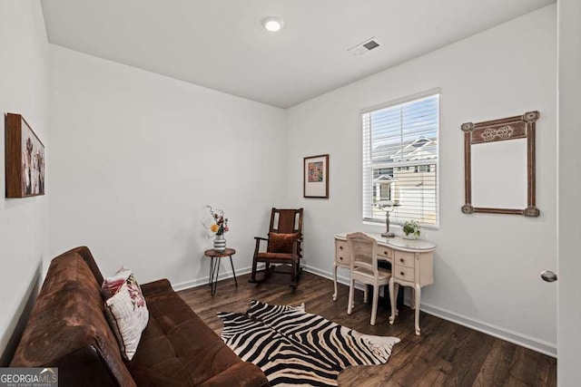 living area with dark hardwood / wood-style flooring