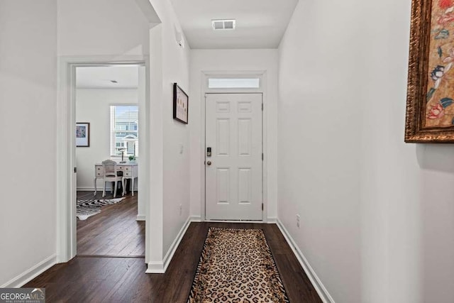 doorway with dark hardwood / wood-style flooring