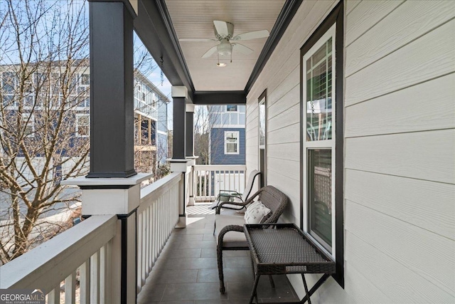 balcony featuring ceiling fan and covered porch