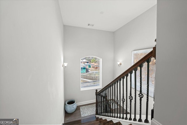 stairs featuring wood-type flooring