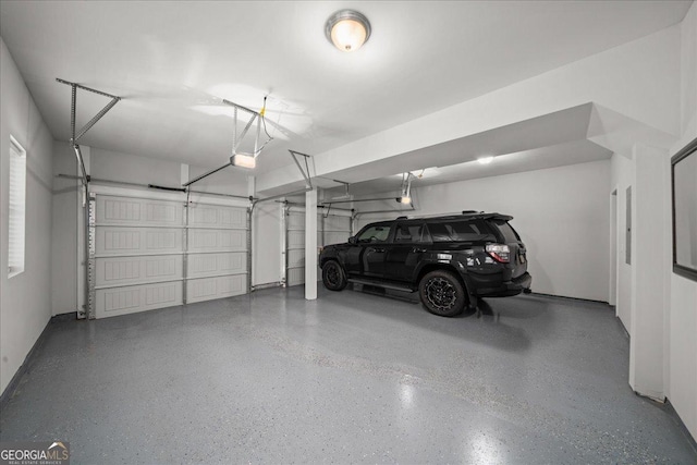 garage featuring a garage door opener