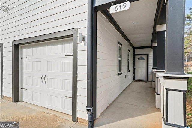 doorway to property featuring a garage