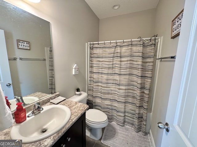 full bathroom with vanity, toilet, shower / tub combo, and a textured ceiling