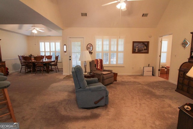 living room with high vaulted ceiling, carpet flooring, and ceiling fan