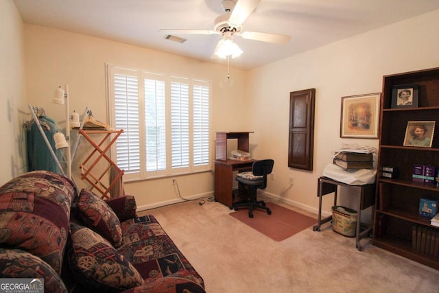 carpeted home office with ceiling fan