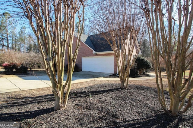 view of side of property featuring a garage