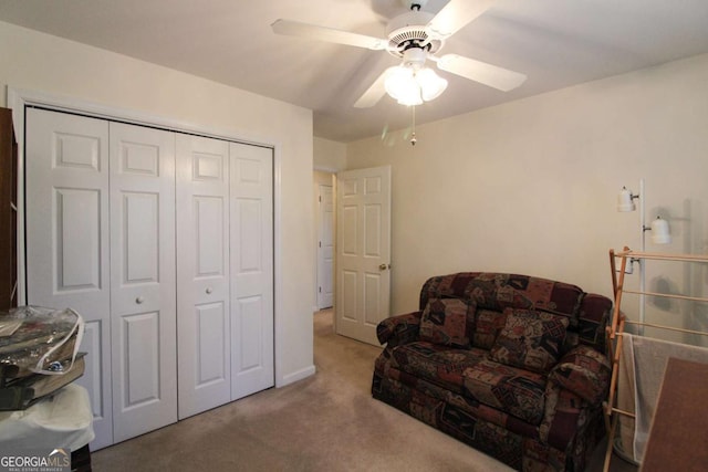 sitting room featuring carpet floors and ceiling fan