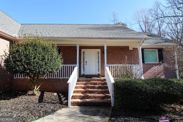 property entrance featuring a porch