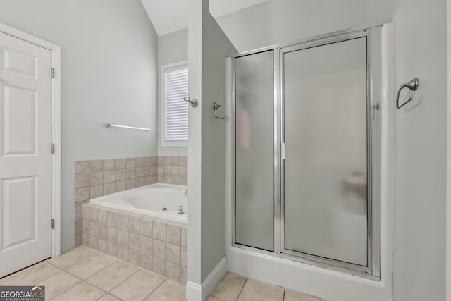 bathroom with tile patterned floors and independent shower and bath