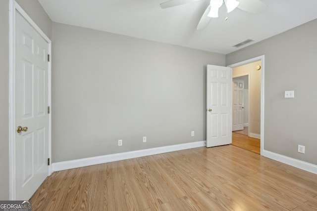 unfurnished bedroom with ceiling fan and light hardwood / wood-style floors