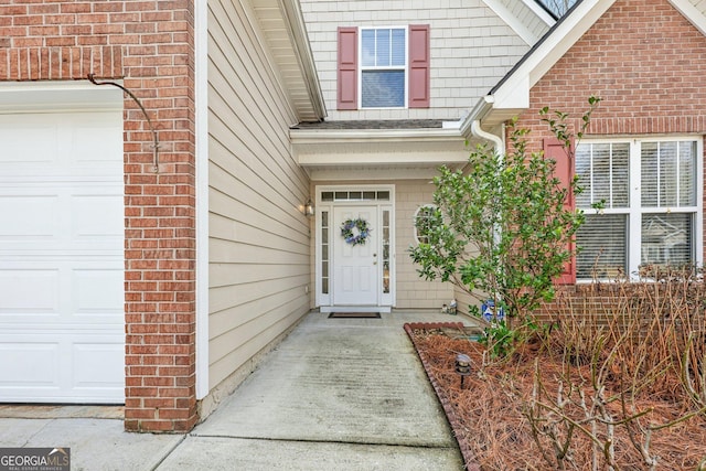 doorway to property featuring a garage