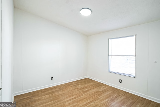 spare room with light wood-type flooring