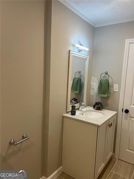 bathroom with vanity and a textured ceiling