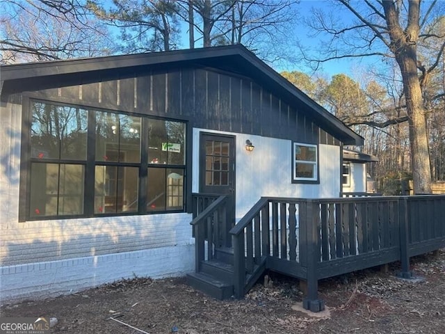 rear view of house with a wooden deck