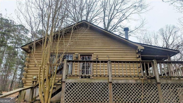 view of side of home featuring a deck