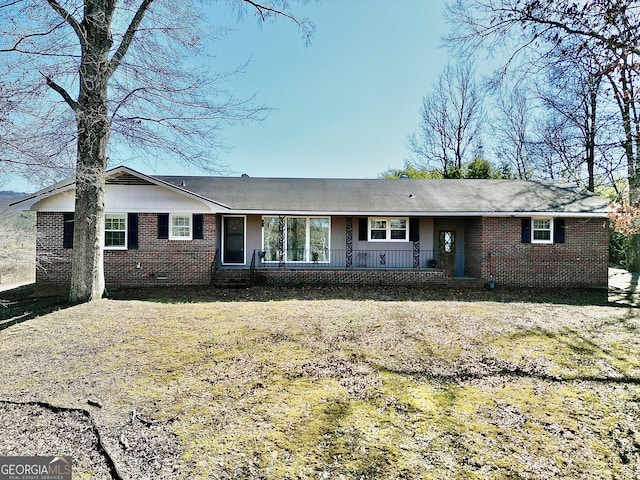 ranch-style house with a front lawn