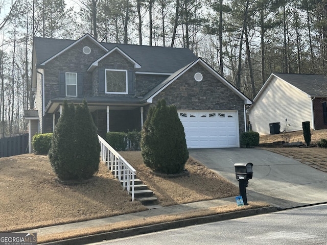 1440 Steam Engine Way NE, Conyers, GA 30013 - traditional home featuring stone siding, concrete driveway, covered porch, a garage, and stairs