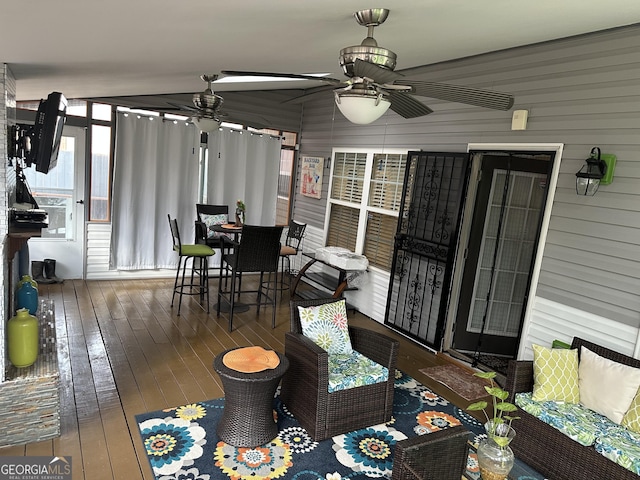 exterior space with ceiling fan and outdoor dining space