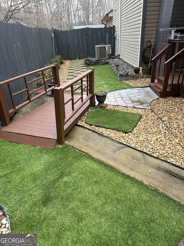 view of yard featuring cooling unit and a fenced backyard