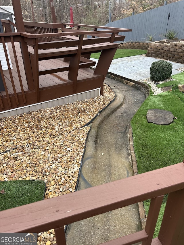 wooden deck featuring fence