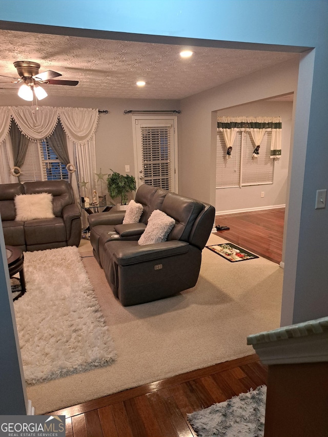 1440 Steam Engine Way NE, Conyers, GA 30013 - living room featuring ceiling fan, wood finished floors, recessed lighting, and a textured ceiling