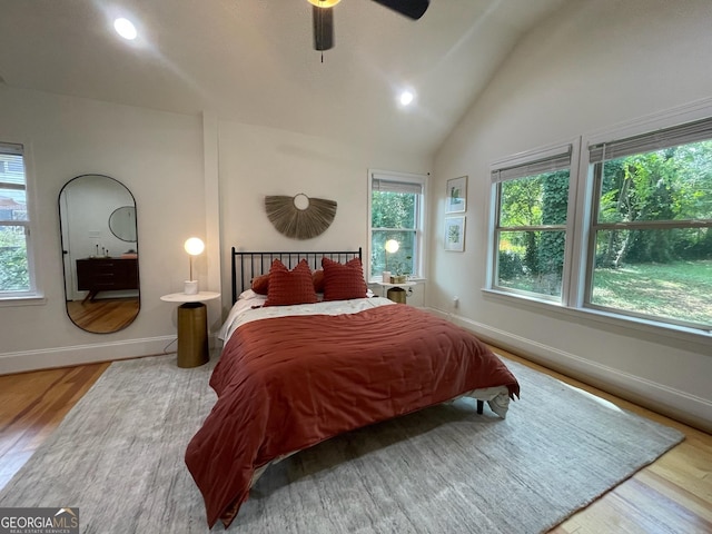 bedroom featuring lofted ceiling, wood-type flooring, and ceiling fan