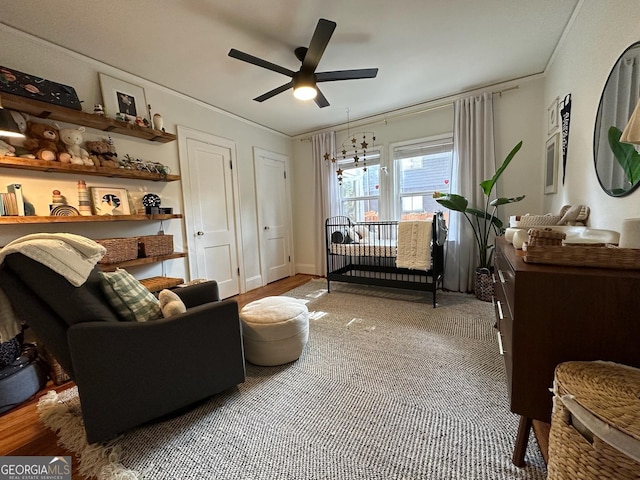 interior space with ceiling fan with notable chandelier