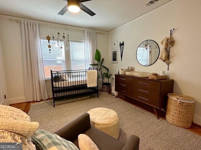 bedroom featuring light wood-type flooring and ceiling fan