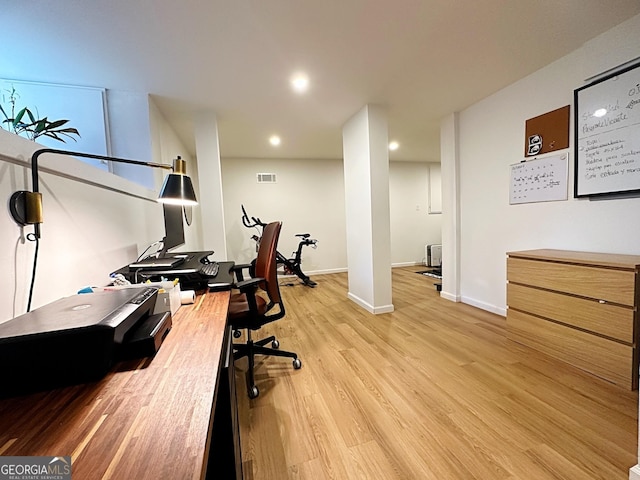 office space with light hardwood / wood-style flooring