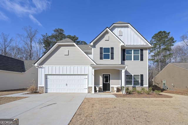 view of front of house with a garage and a front lawn