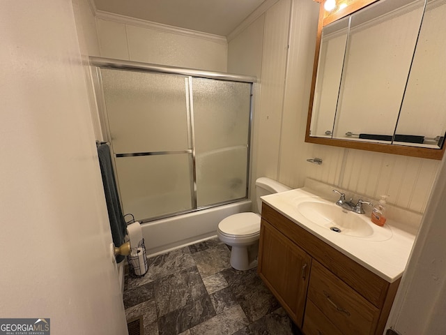 full bathroom with toilet, ornamental molding, vanity, and shower / bath combination with glass door