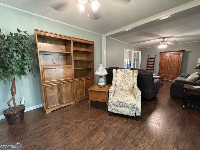 living room featuring ornamental molding, dark hardwood / wood-style floors, a textured ceiling, and ceiling fan