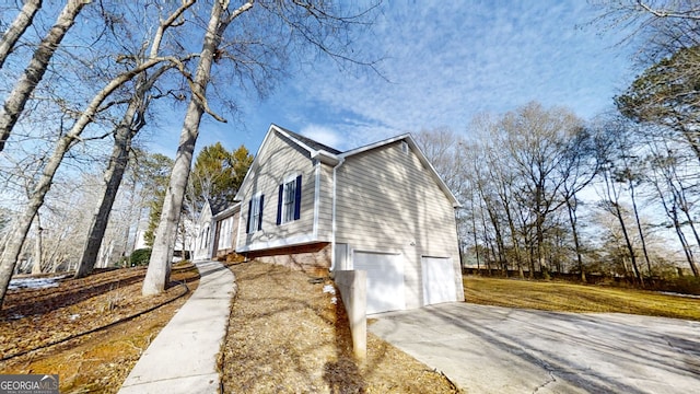 view of side of home with a garage