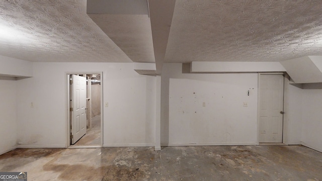 basement with a textured ceiling