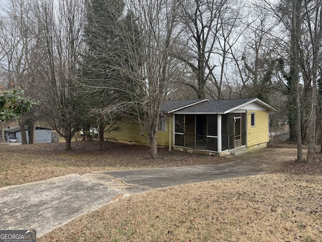 view of yard with a sunroom