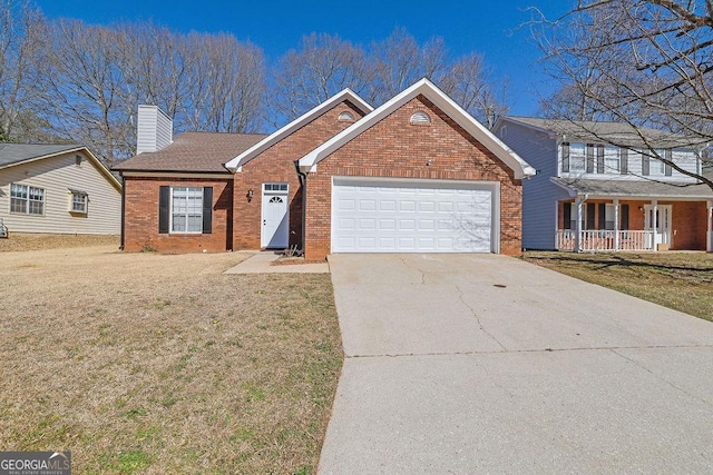 view of front facade featuring a garage and a front lawn