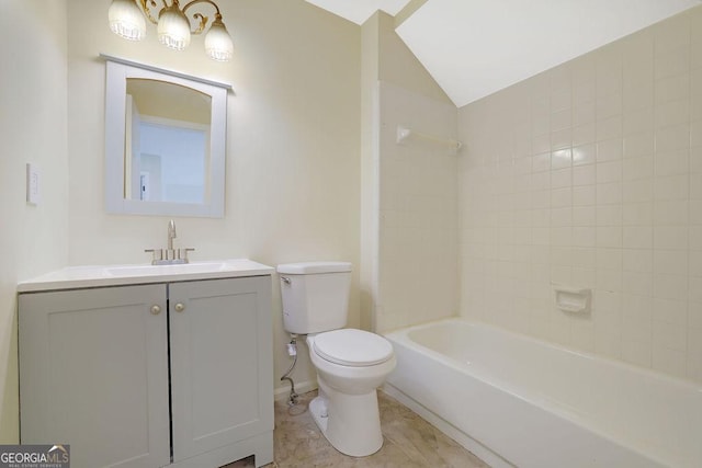 full bathroom with vanity, tiled shower / bath combo, vaulted ceiling, and toilet