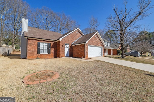 ranch-style home featuring a garage and a front lawn